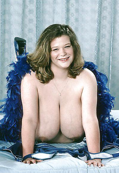 25P Busty dark-blonde BBW posing her ample assets