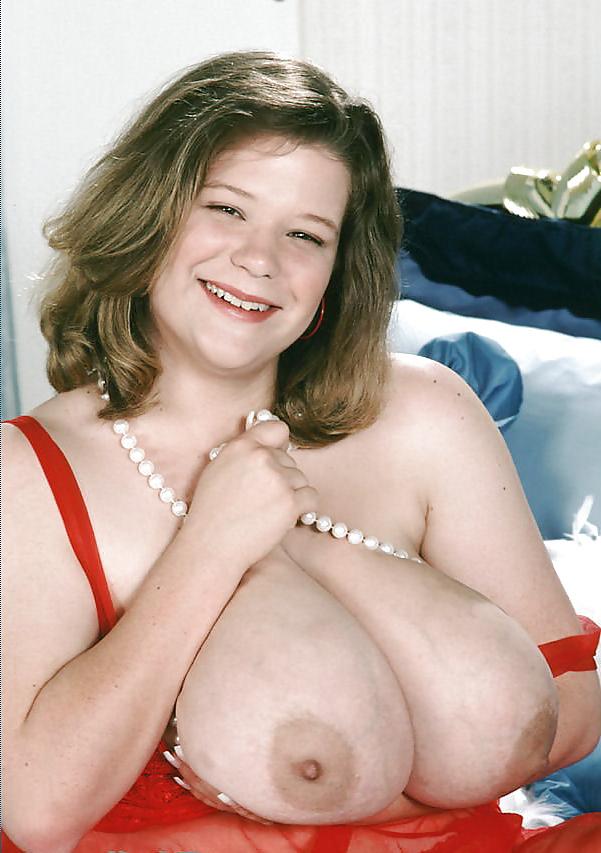 25P Busty dark-blonde BBW posing her ample assets
