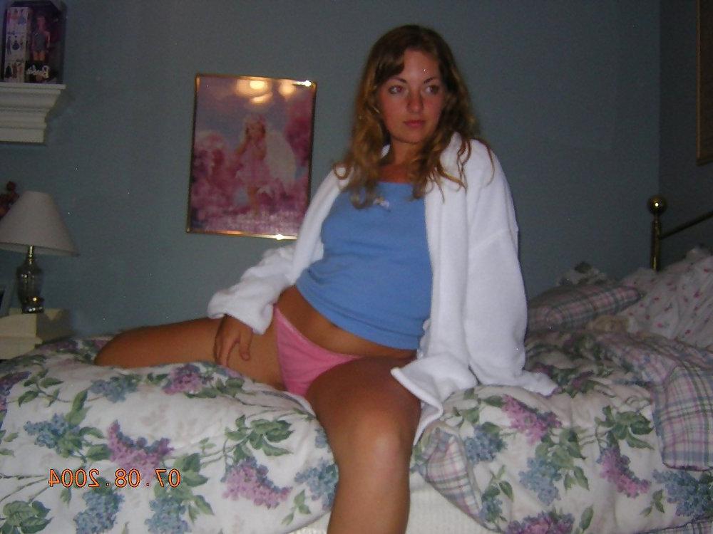 11P Blonde posing on her bed and fingering her pussy