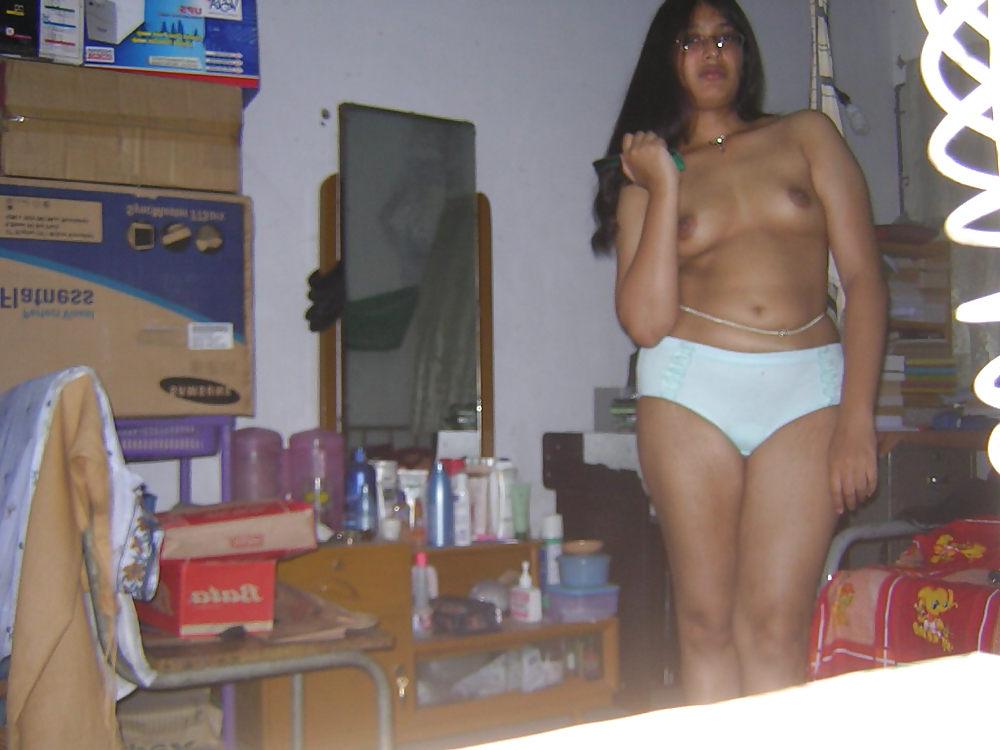 25P Young asian gets her tits out