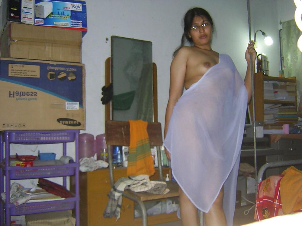 25P Young asian gets her tits out