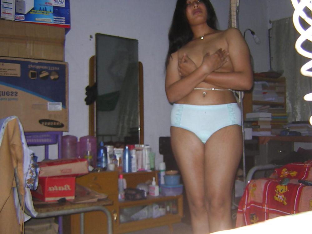 25P Young asian gets her tits out