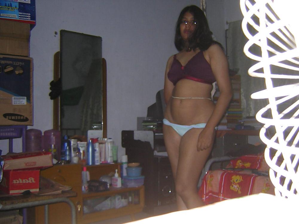 25P Young asian gets her tits out