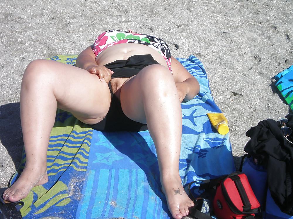25P Old granny at beach 