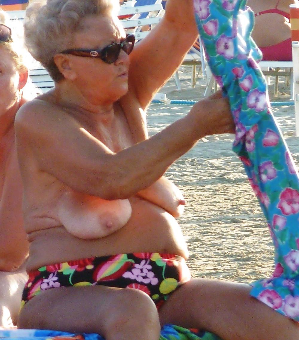 25P Old granny at beach 