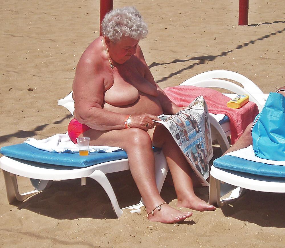 25P Old granny at beach 