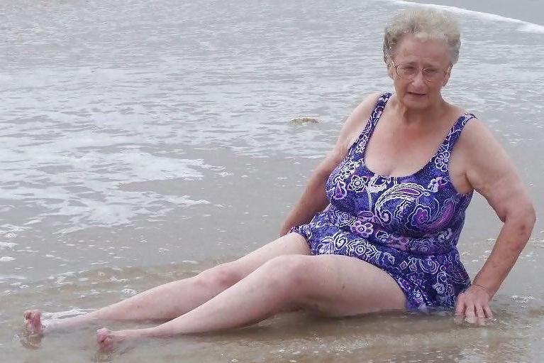 25P Old granny at beach 