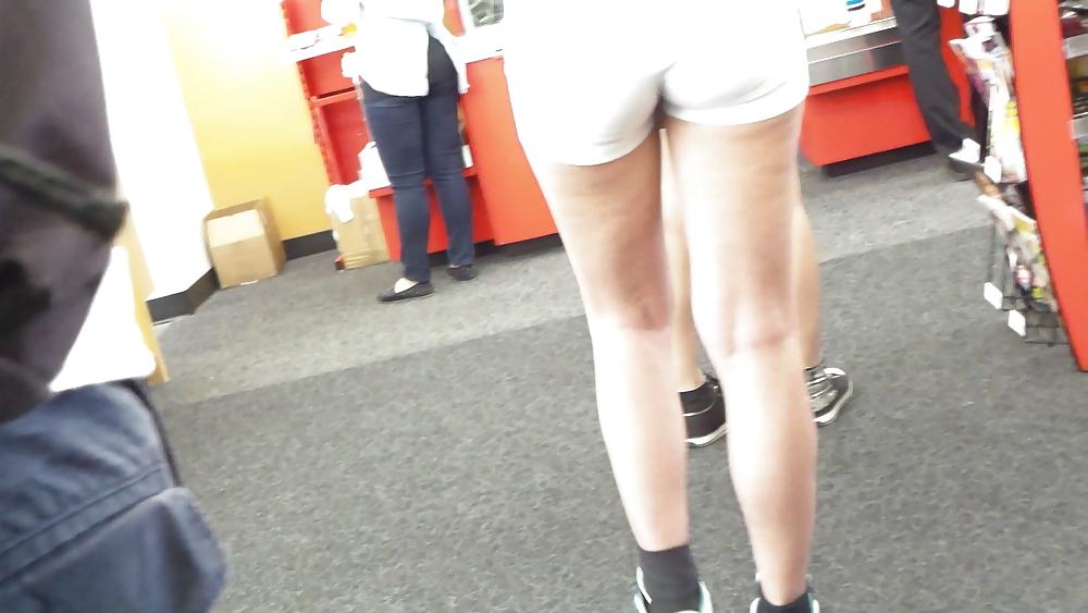 23P Teen ass crack & butt in tight white shorts