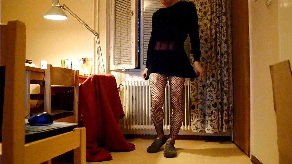 6P Trap in dress and stockings with buttplug behind