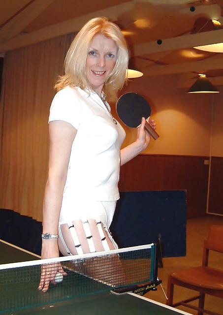 15P Mature leggy lady plays table tennis