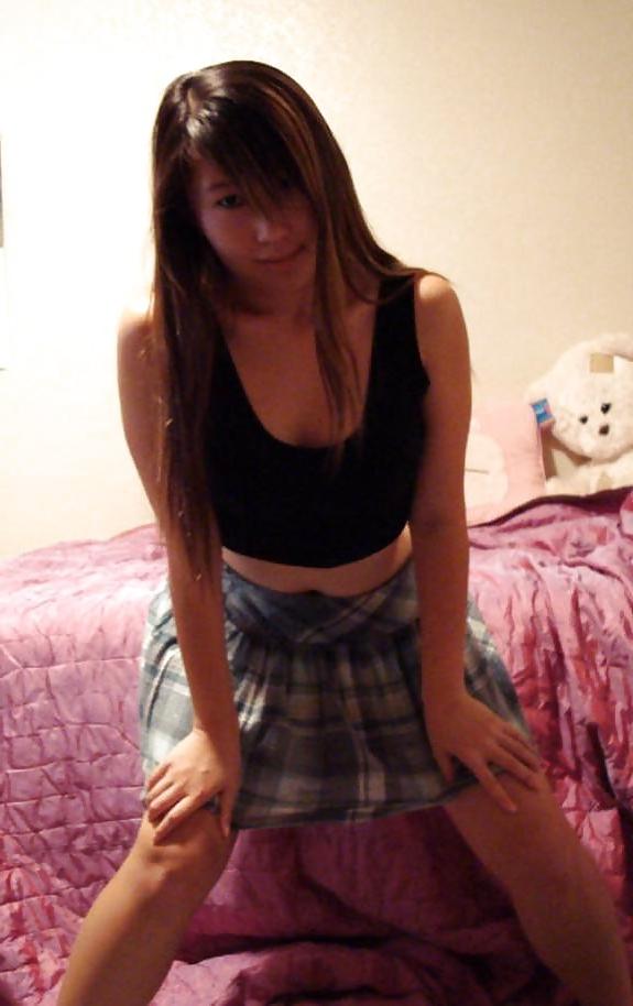 25P Cute Asian posing in front of Webcam.