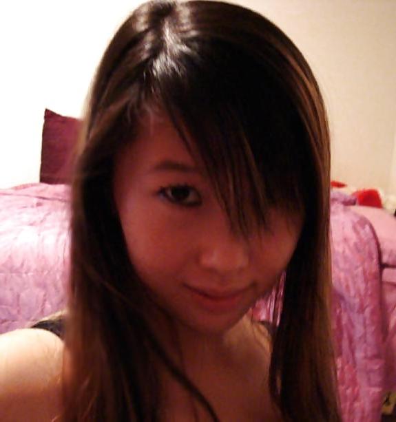 25P Cute Asian posing in front of Webcam.