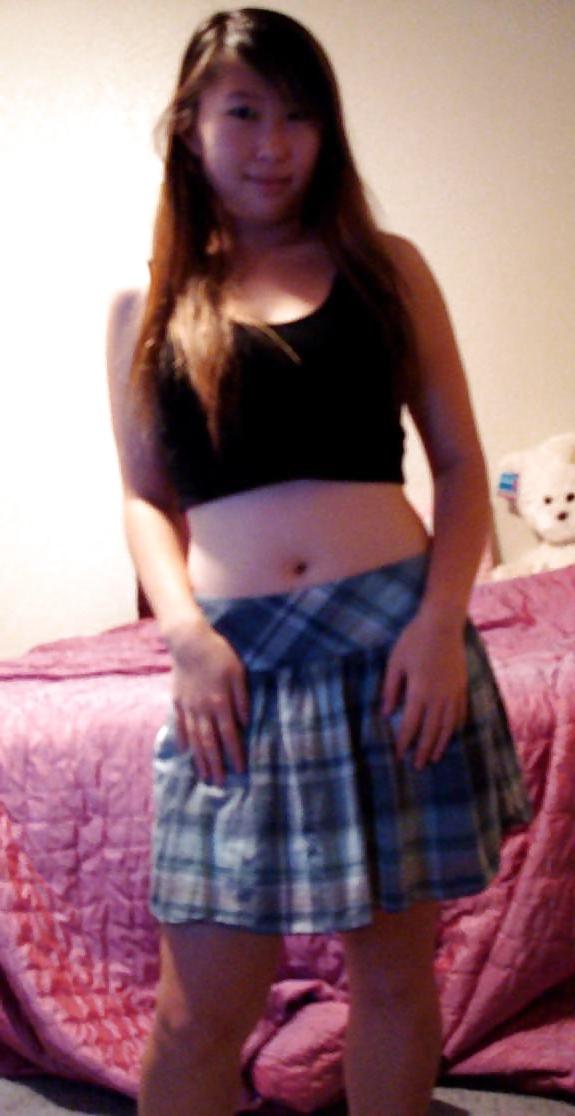 25P Cute Asian posing in front of Webcam.