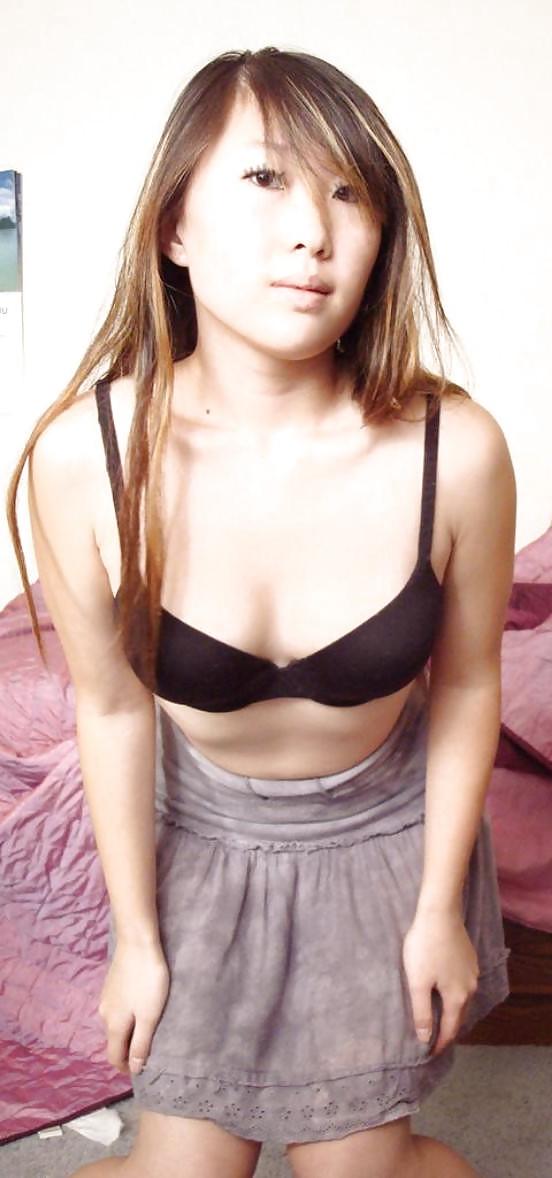 25P Cute Asian posing in front of Webcam.