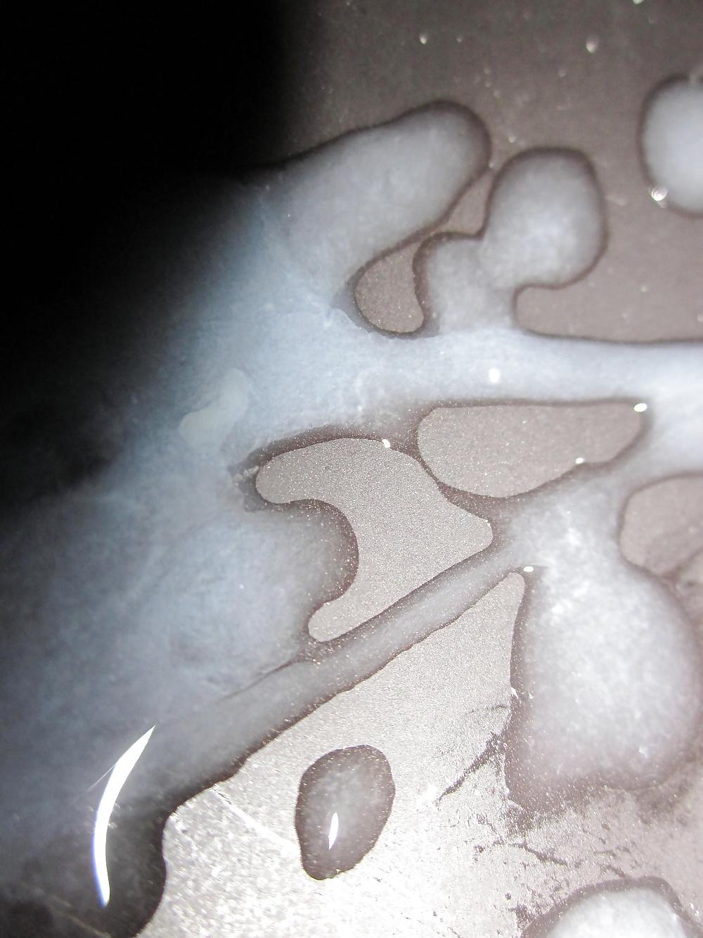 6P Close up cum shot on a black plate