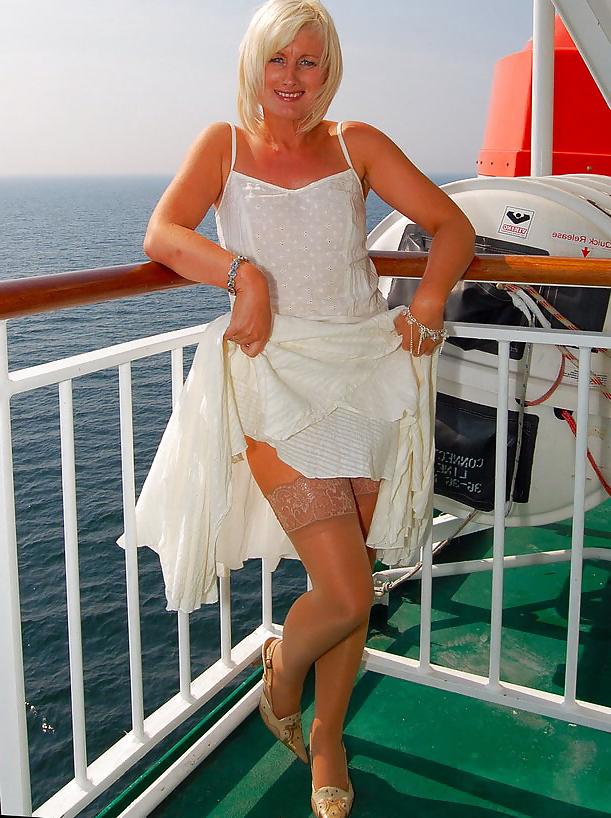 25P Older lady travels poses outdoors