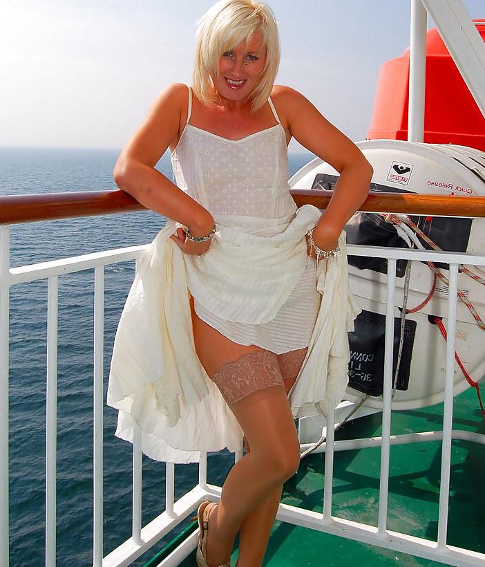 25P Older lady travels poses outdoors