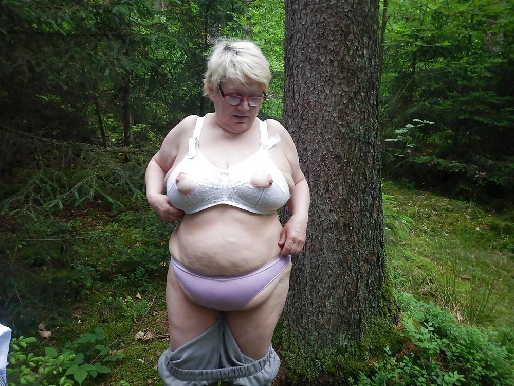 23P Busty granny in forest