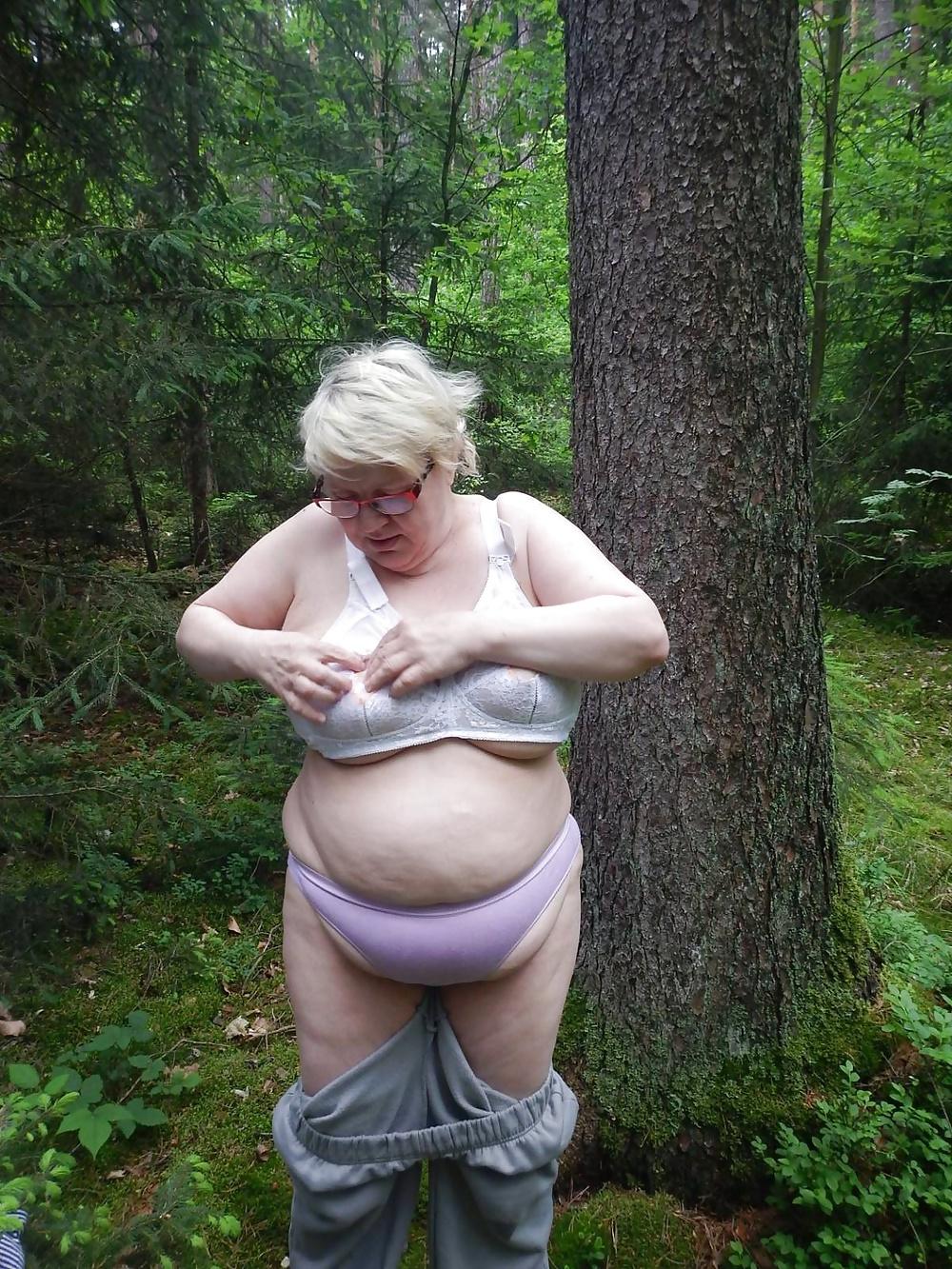 23P Busty granny in forest