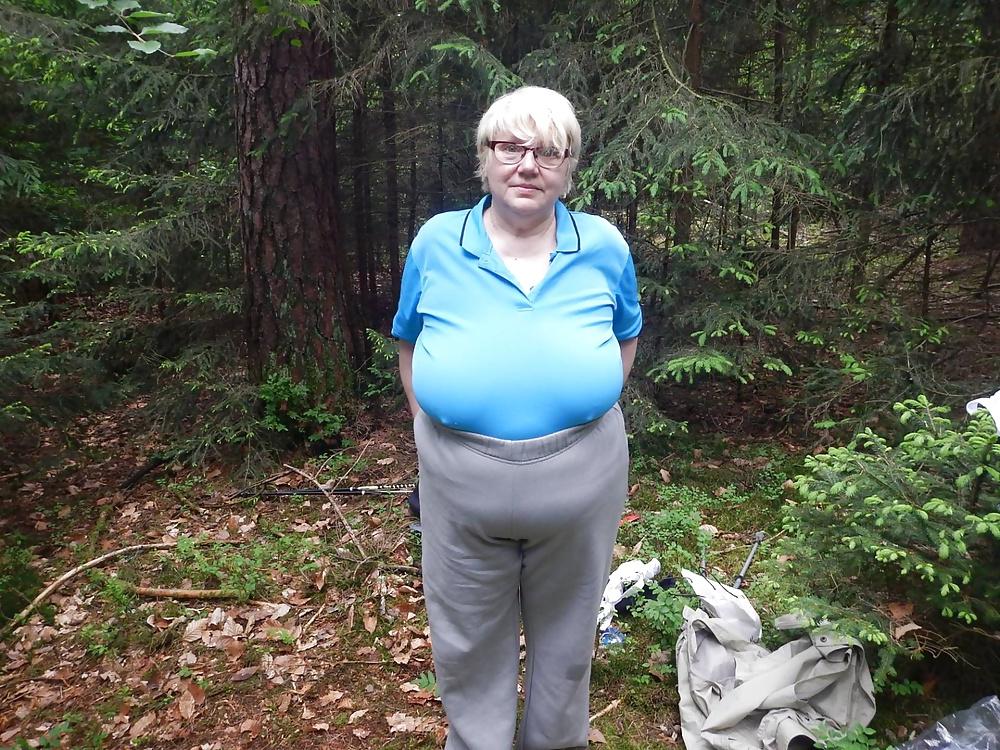 23P Busty granny in forest