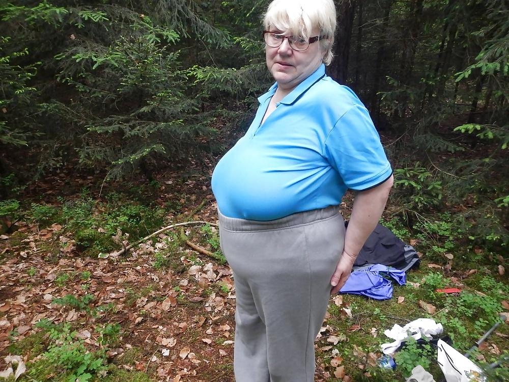 23P Busty granny in forest