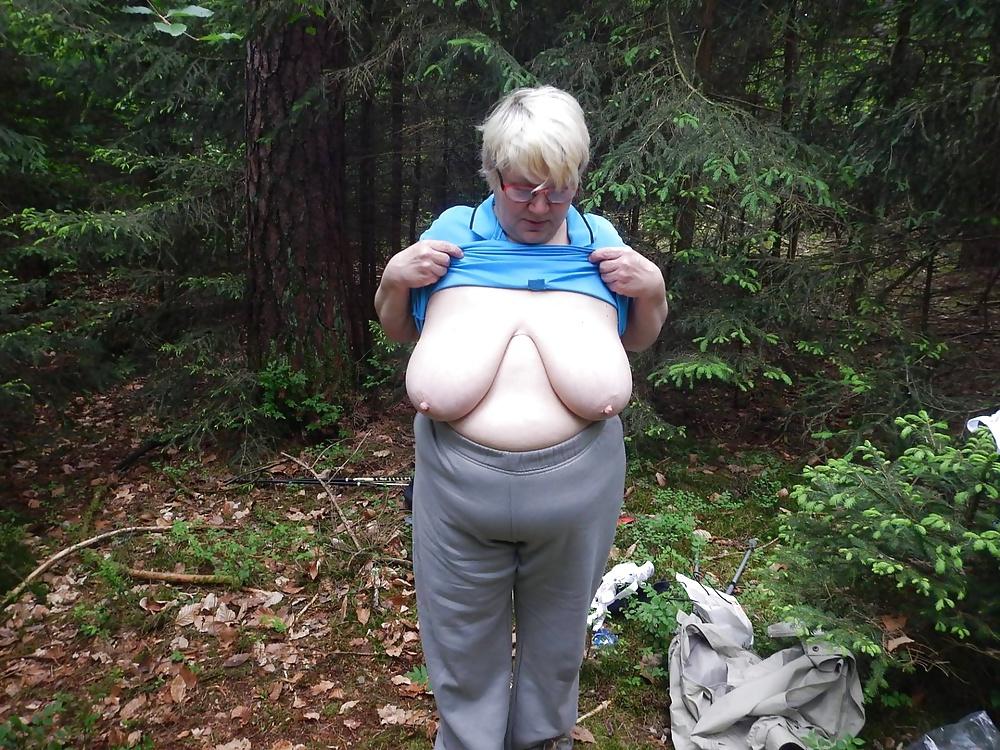 23P Busty granny in forest