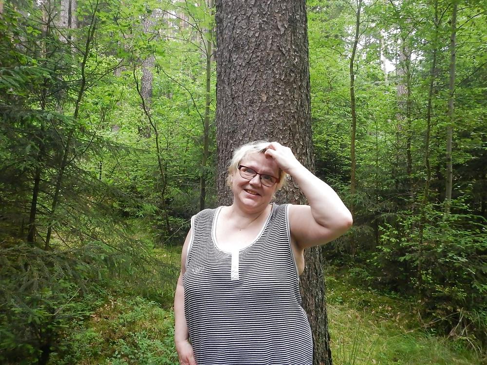 23P Busty granny in forest