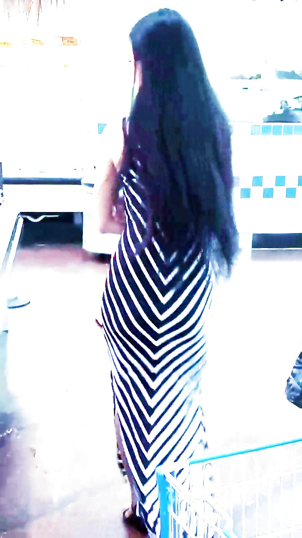 12P Sexy filipino babe in long striped skirt shopping for meat