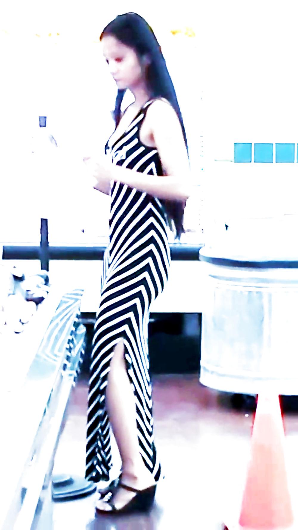 12P Sexy filipino babe in long striped skirt shopping for meat