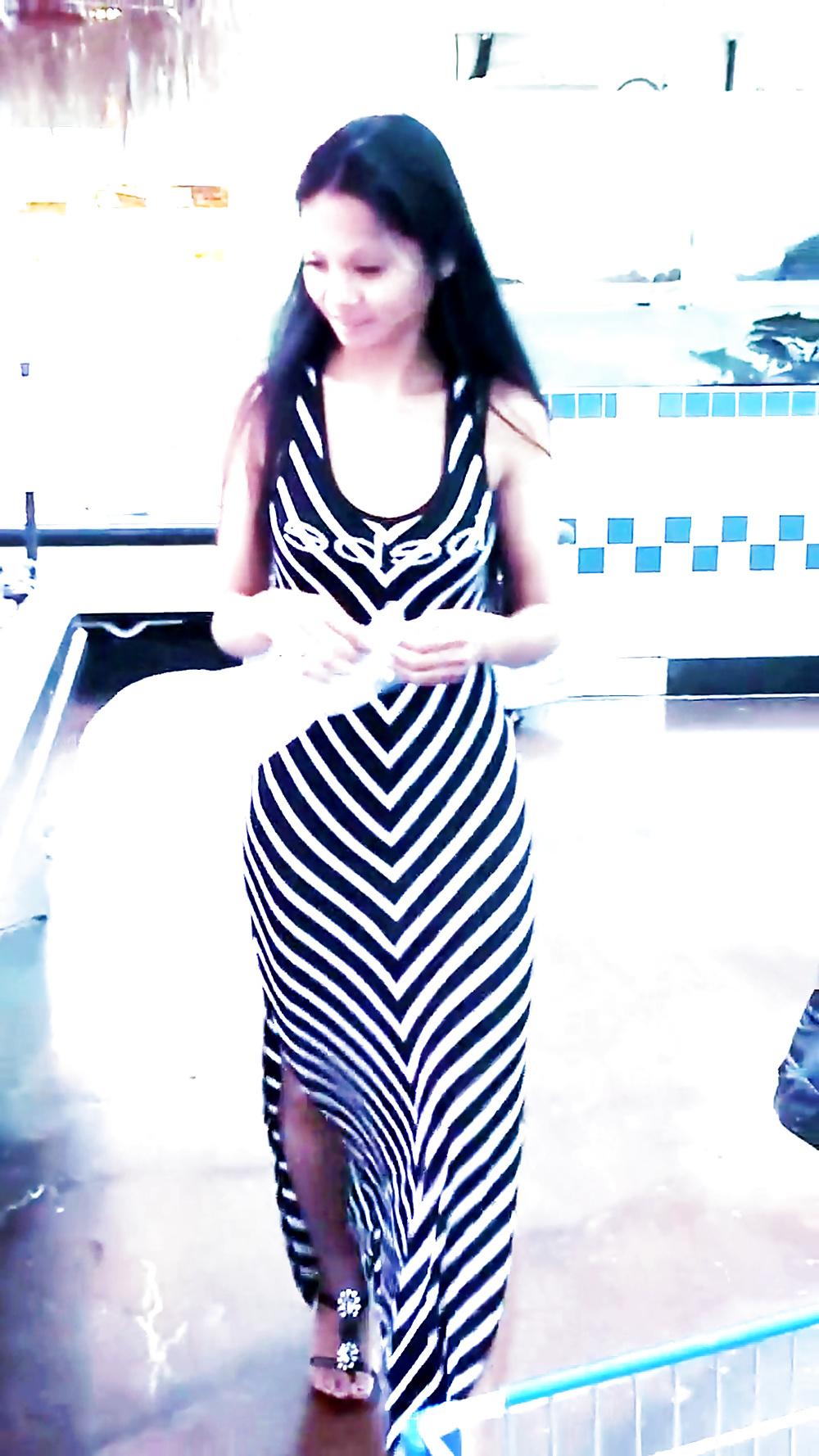 12P Sexy filipino babe in long striped skirt shopping for meat