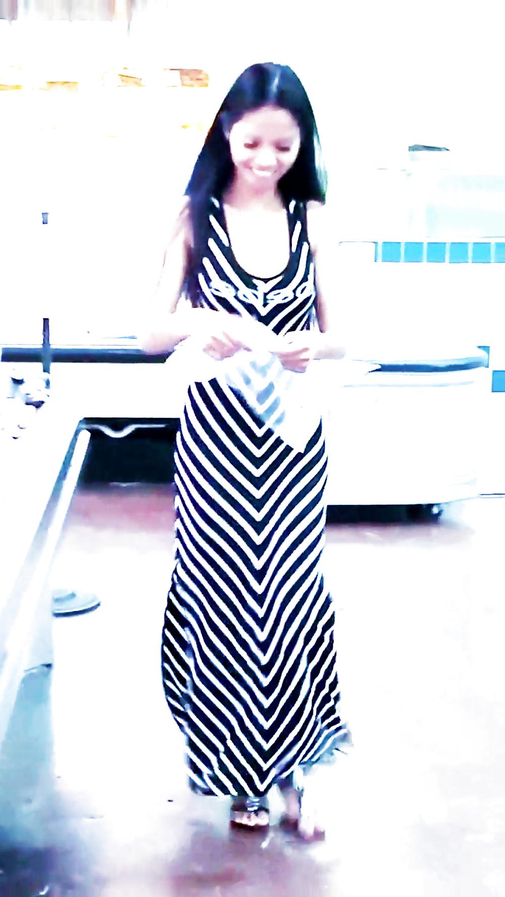 12P Sexy filipino babe in long striped skirt shopping for meat