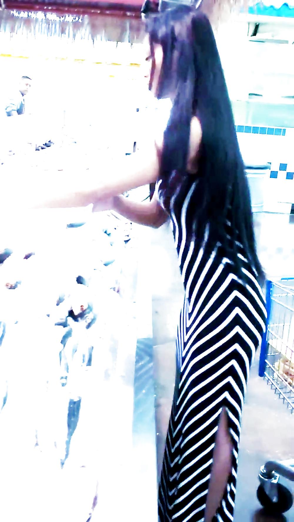 12P Sexy filipino babe in long striped skirt shopping for meat