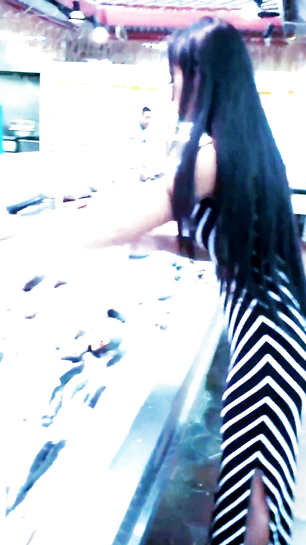12P Sexy filipino babe in long striped skirt shopping for meat