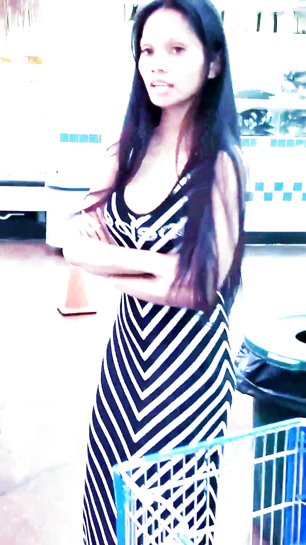 12P Sexy filipino babe in long striped skirt shopping for meat