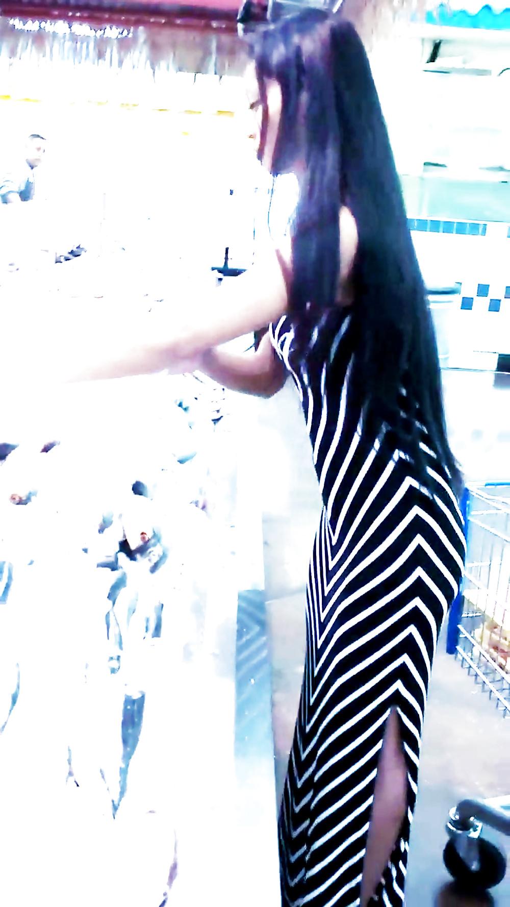 12P Sexy filipino babe in long striped skirt shopping for meat