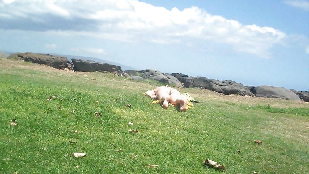 9P Laying with her ass & butt in a field of grass