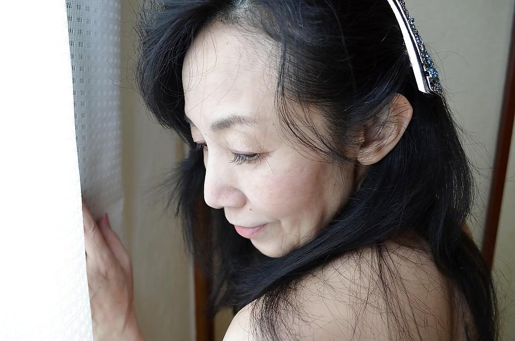 16P Great looking natural tits on Tsuyako Miyataka who is a hairy mature