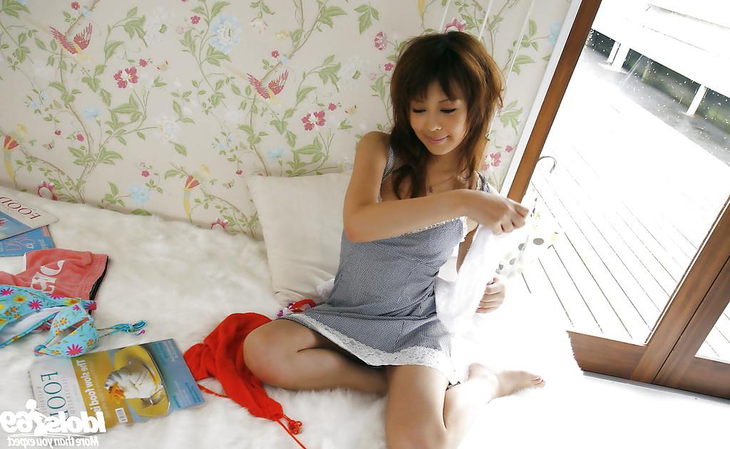14P Sweet asian teen babe uncovering her big tits with perky nipples