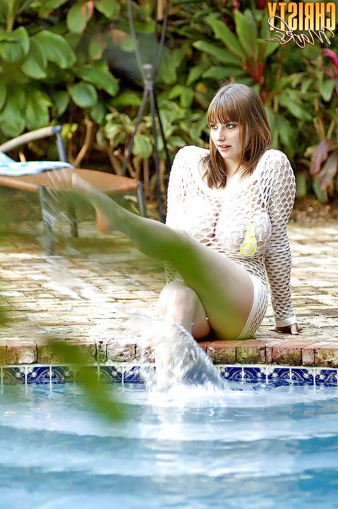 16P Busty bbw girl Christy Marks stripping from fishnets and bikini in the pool