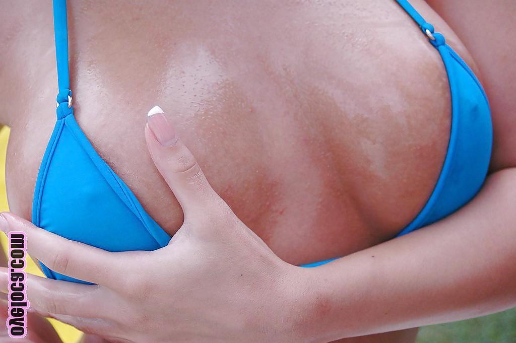 16P Hot blonde with big tits undressing and oiling up her body