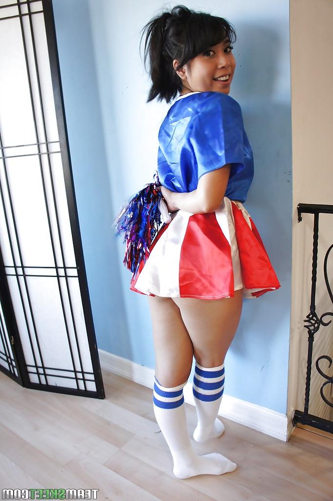 16P Tiny Asian cheerleader May Lee posing in cute uniform and socks