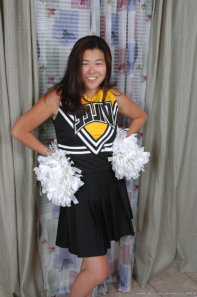 16P Amateur Asian cheerleader undresses to reveal trimmed vagina