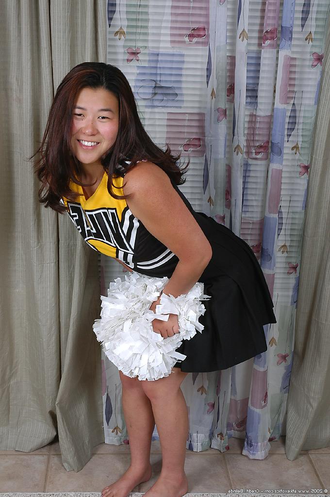 16P Amateur Asian cheerleader undresses to reveal trimmed vagina