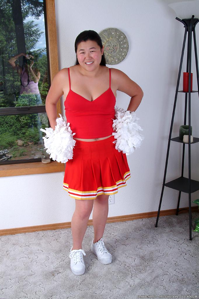 16P Chubby Asian first timer baring small boobs while shedding cheer uniform
