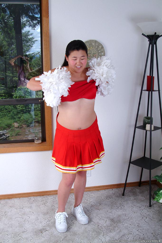 16P Chubby Asian first timer baring small boobs while shedding cheer uniform