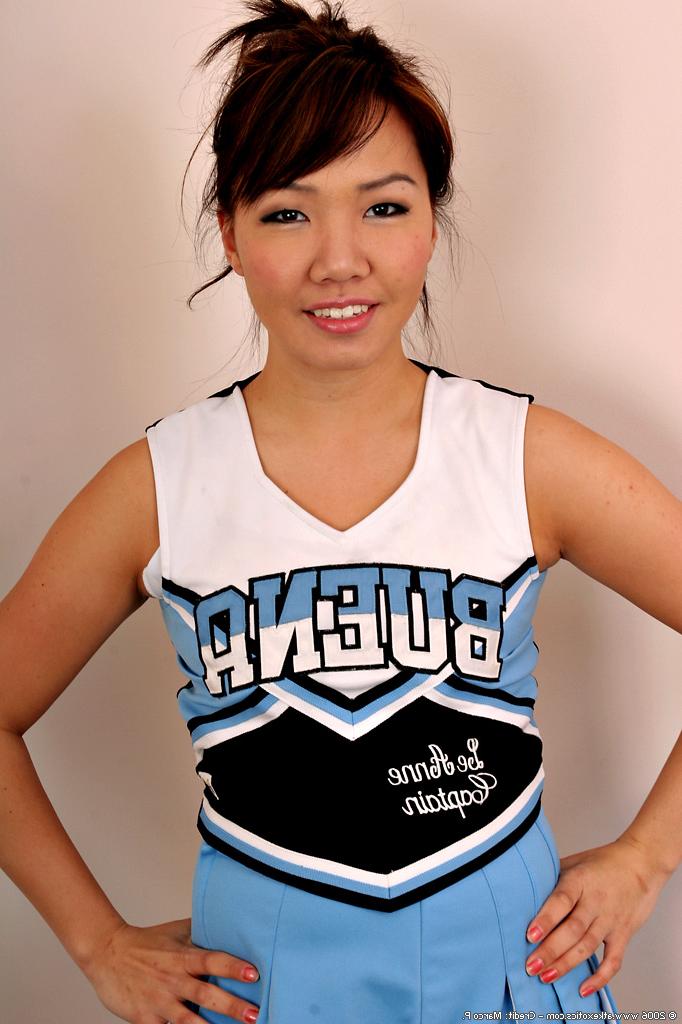 16P Amateur Asian solo girl sheds cheerleader uniform to bare tiny teen tits