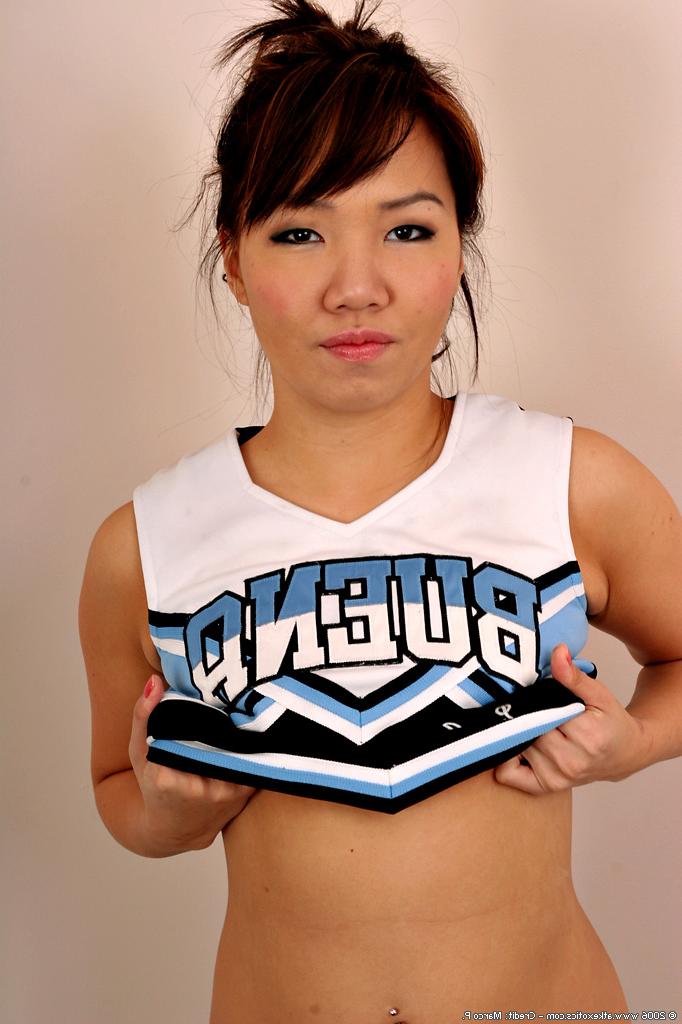 16P Amateur Asian solo girl sheds cheerleader uniform to bare tiny teen tits