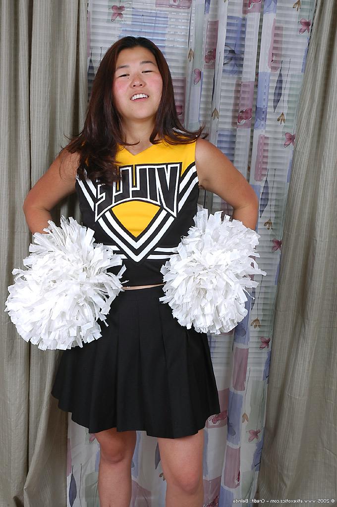 16P Asian amateur strips off cheerleader uniform before spreading pussy lips
