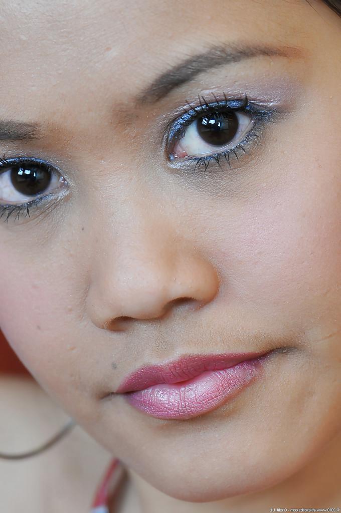 16P Young Asian schoolgirl Joana parts pink cunt in extreme close ups