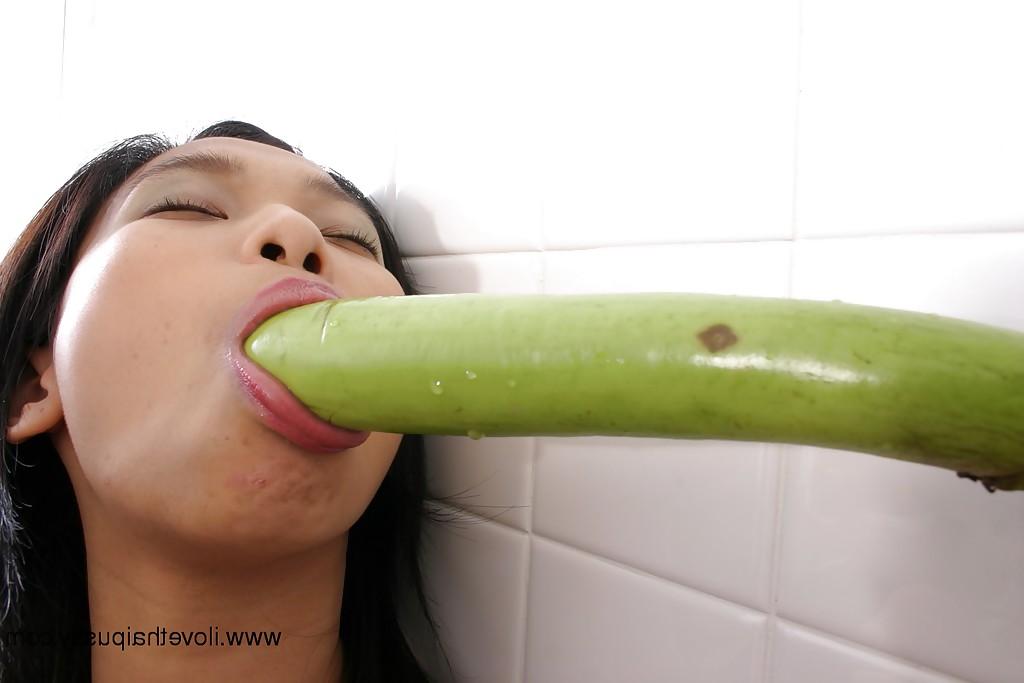 16P Horny Asian slut spreads hairy twat and masturbates with vegetable